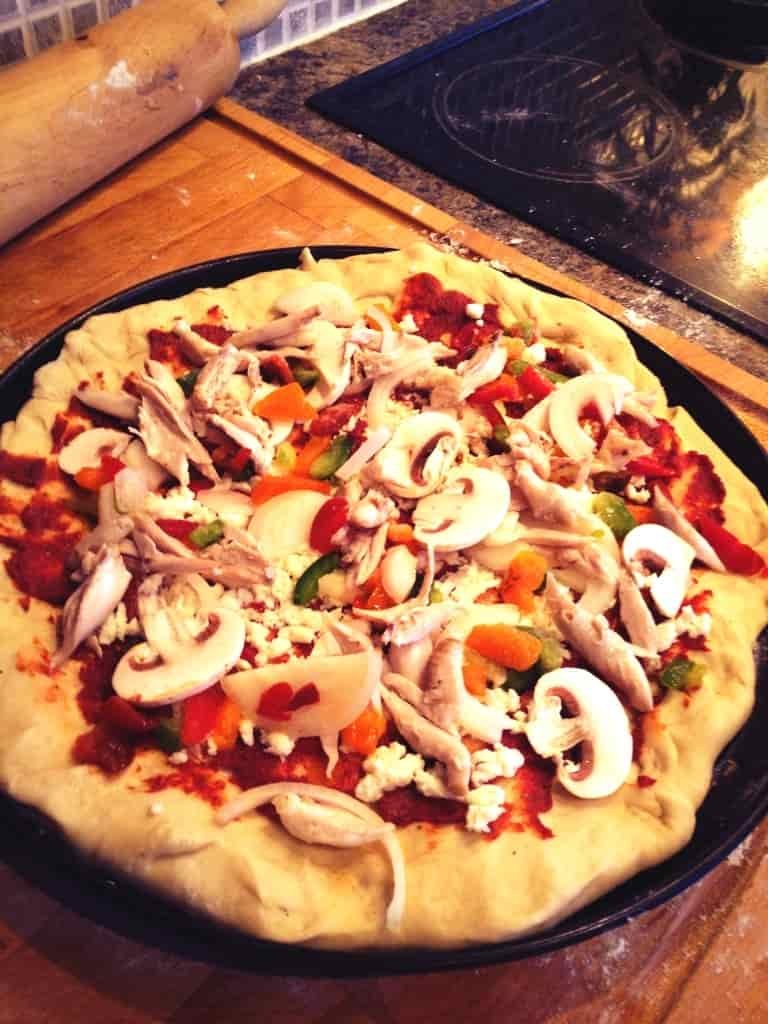 Adding the pizza toppings to the base