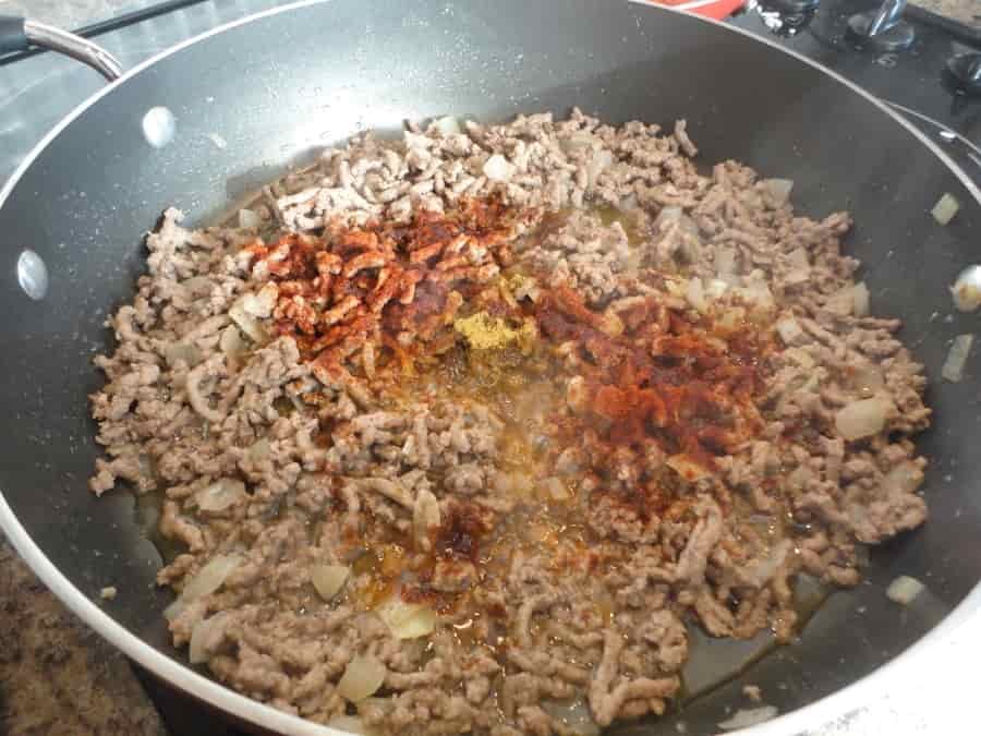 This Mexican beef and bean burrito is a cheap, easy to make recipe that is perfect for a Saturday night with the family. Delicious!