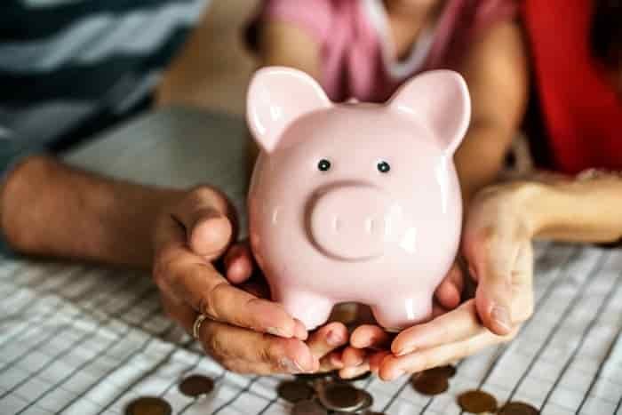 holding a piggy bank