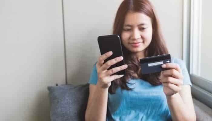 woman paying on phone