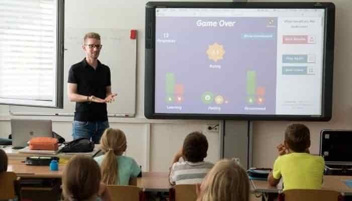 teacher standing at front of class
