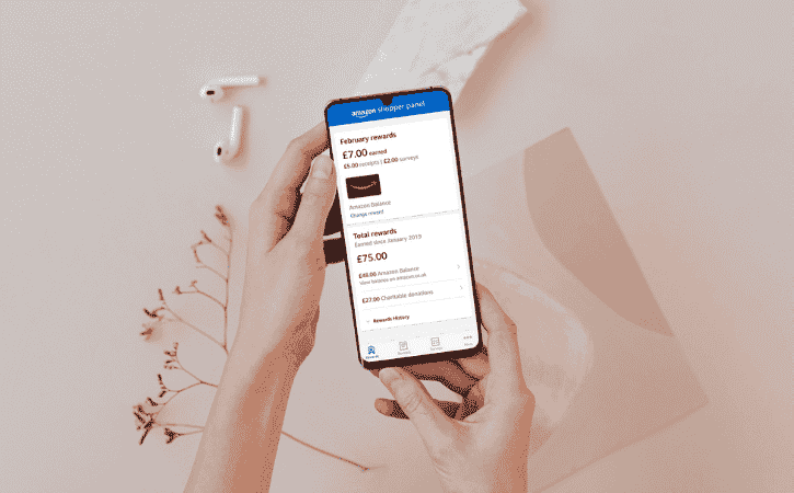 hands holding phone showing amazon shopper panel app