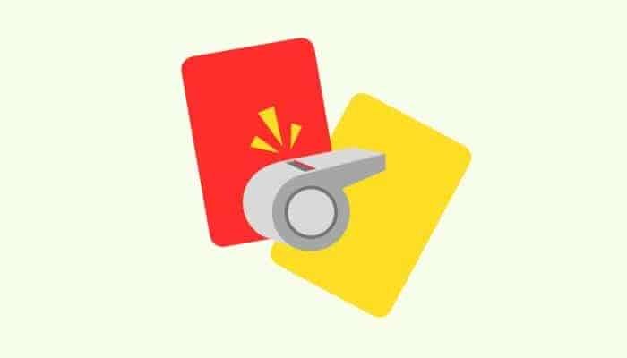 cartoon of a red and yellow football card with a whistle on top of them.
