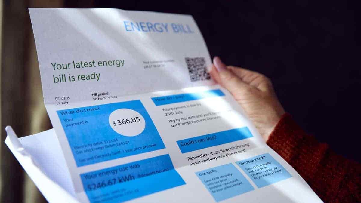 A person holding an energy bill