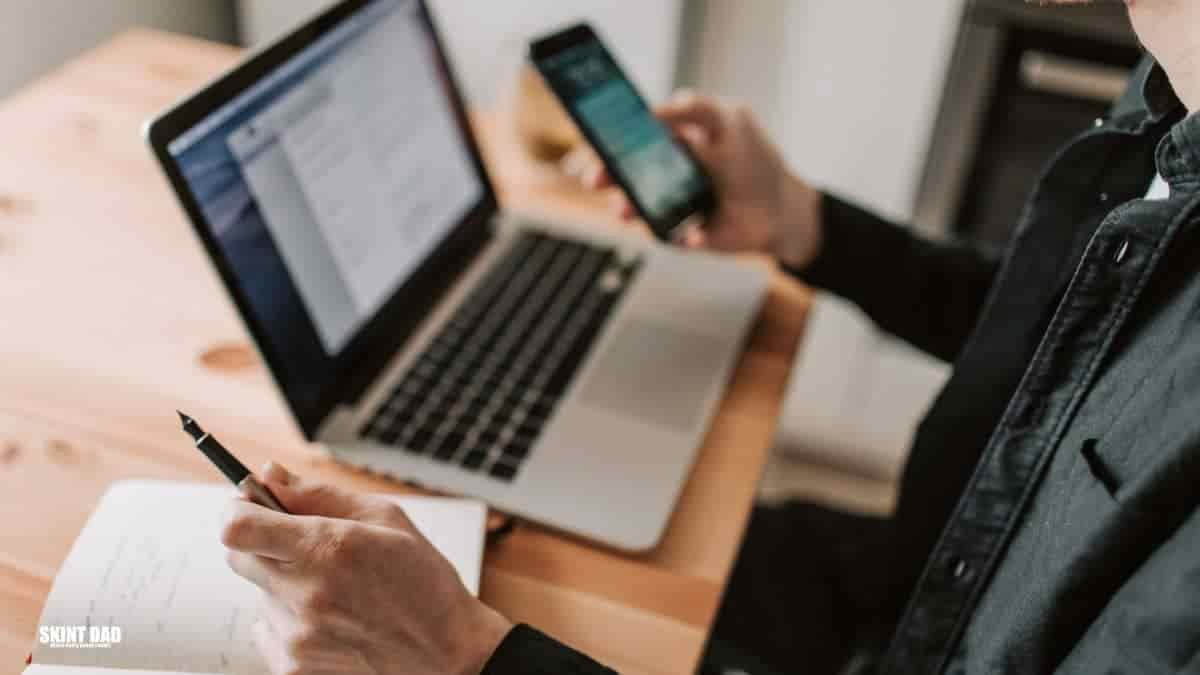 Person using a budgeting app with AI tools to manage money at home.